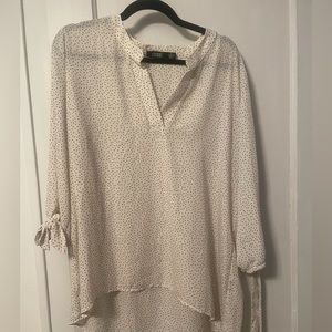 Polka dot blouse, v neck longer in back. Worn once‎